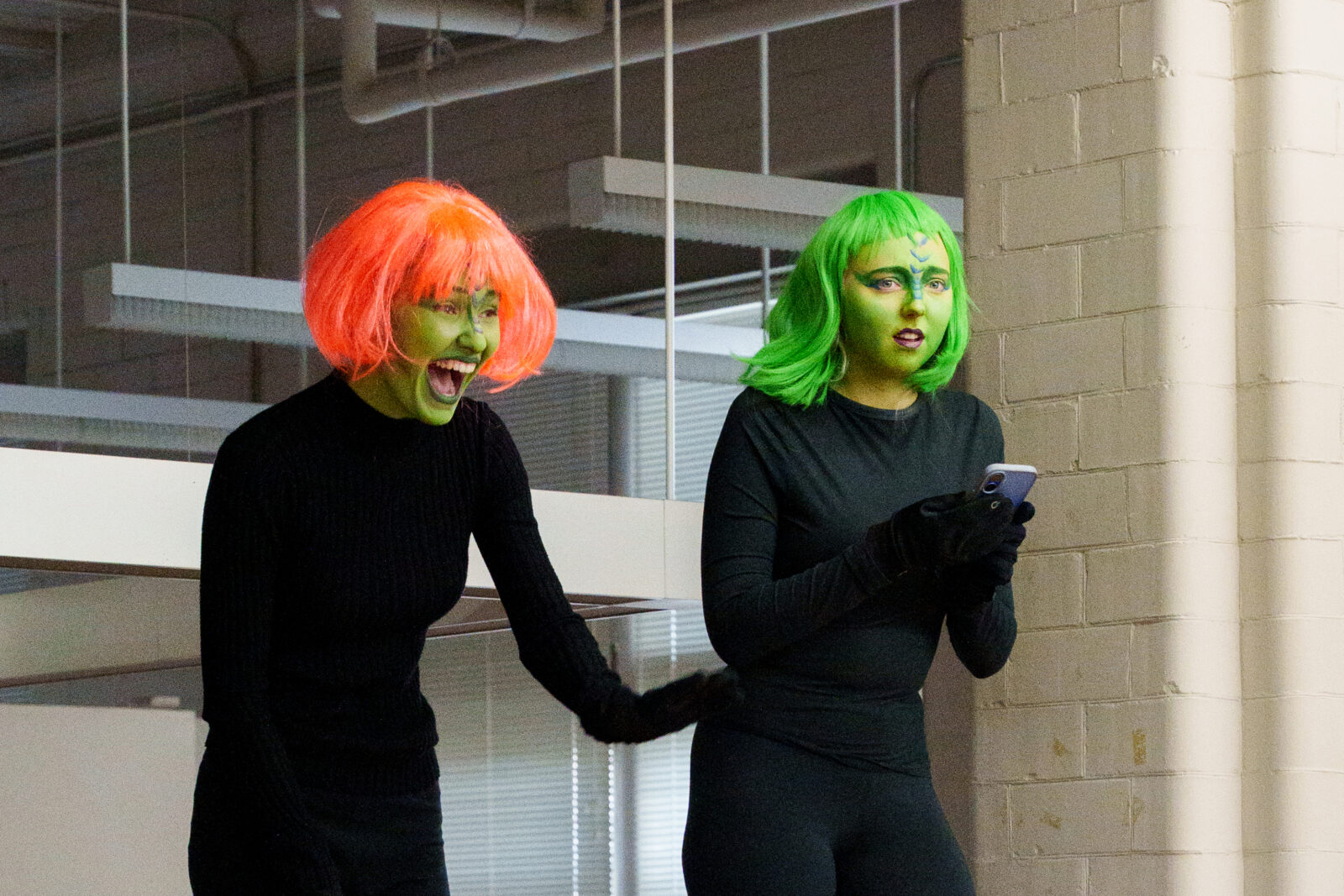 performance where actors with green face paint play future species