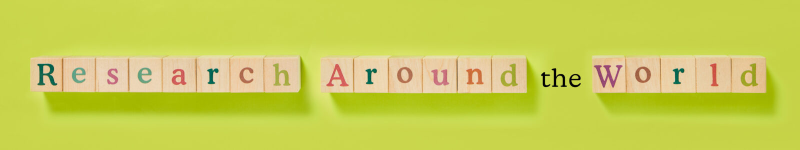 Research around the world spelled with wooden blocks