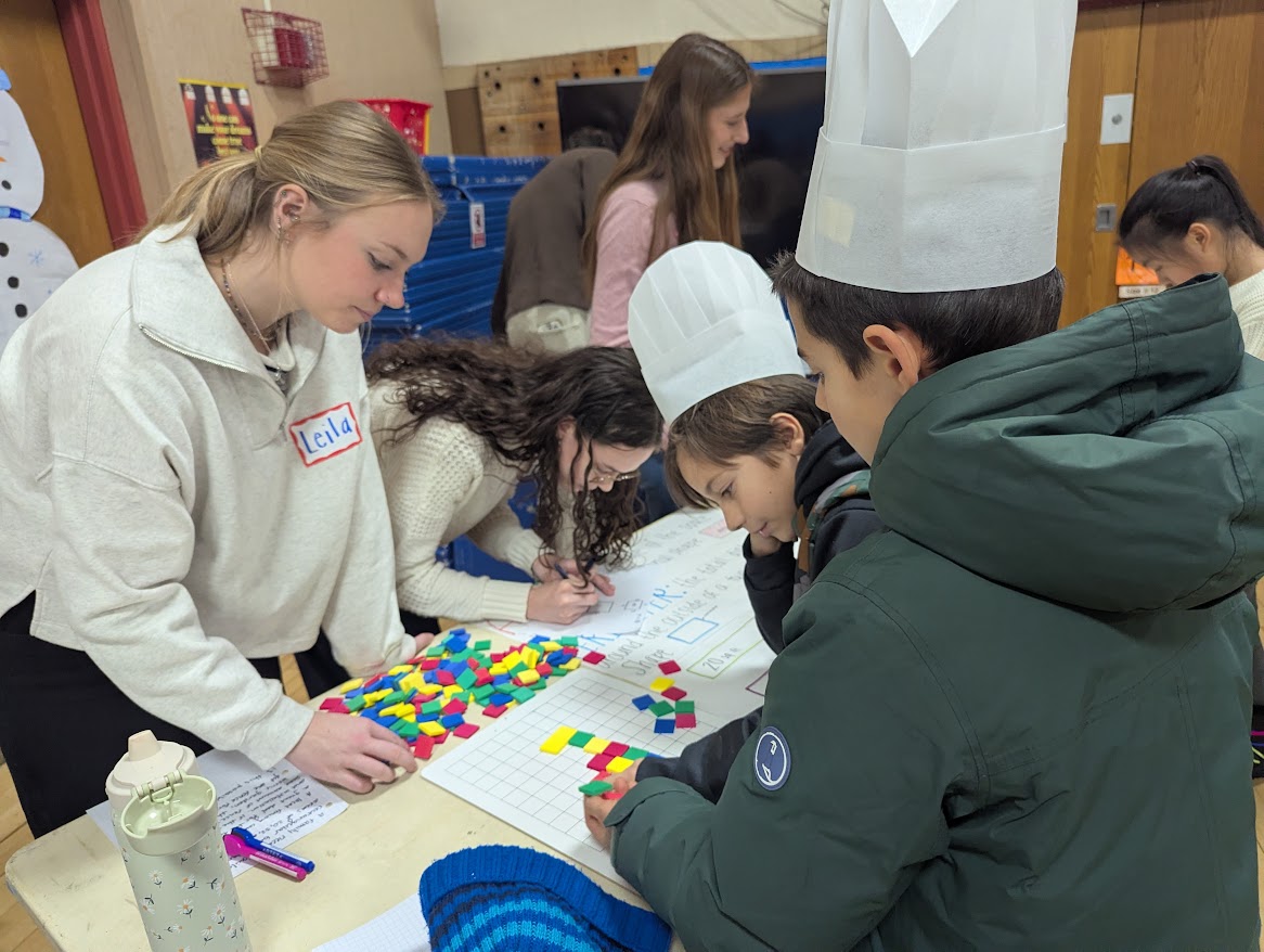 children doing math with colorful tiles